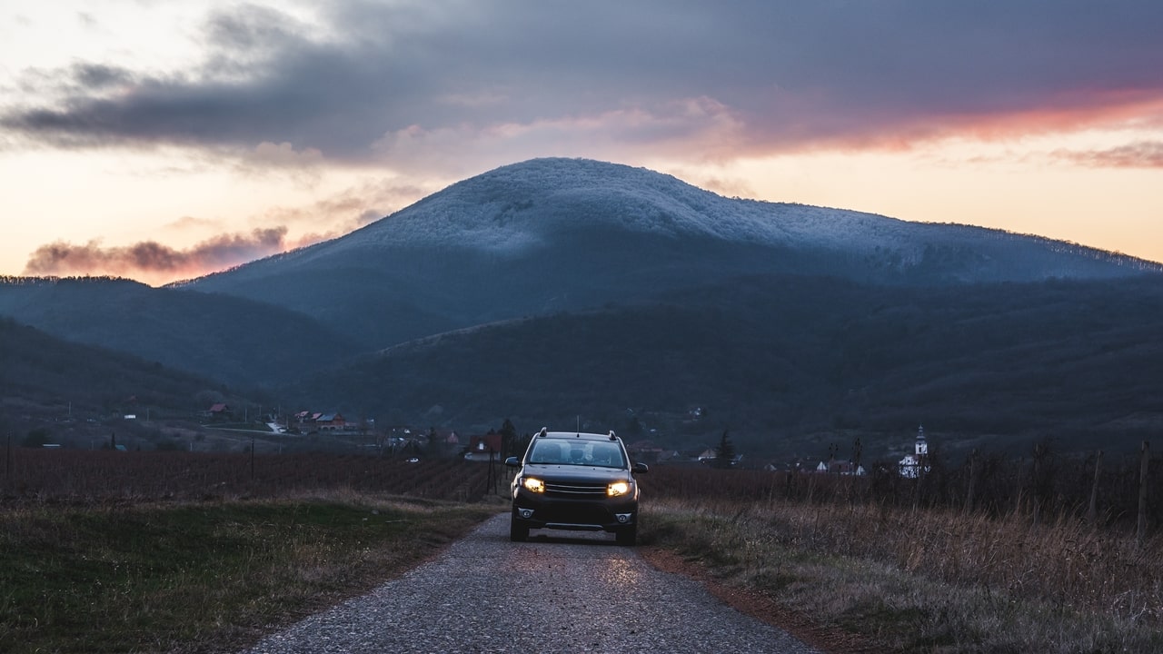 car-road-with-mountain-sunset-min