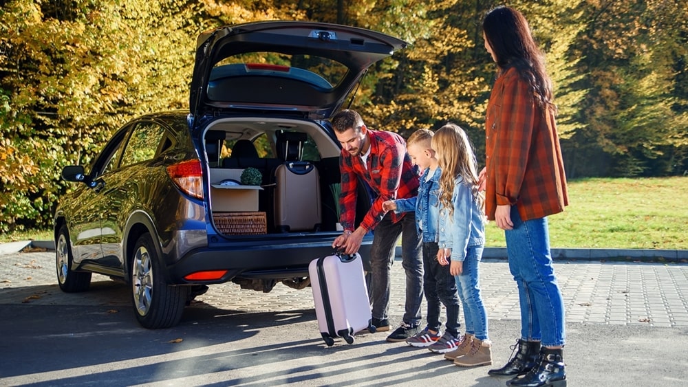 lovely-young-family-loading-car-16×9-min