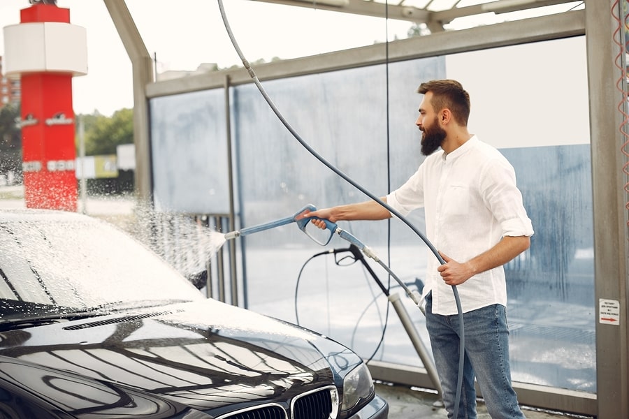 man-washing-his-car-washing-station-900-min